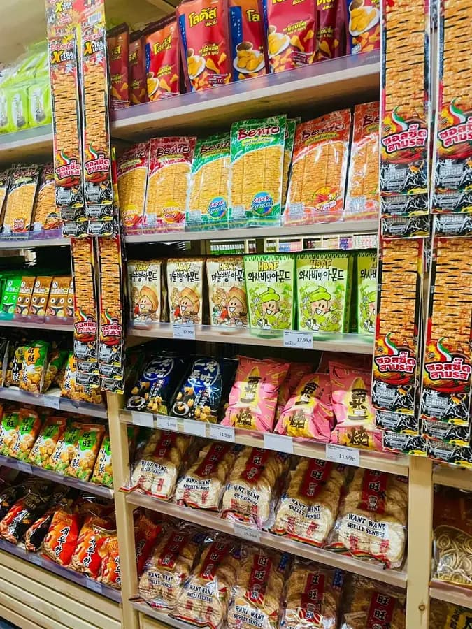 Asian snack aisle with Bento squid snacks, HBAF almonds and Want Want rice crackers in Wrocław