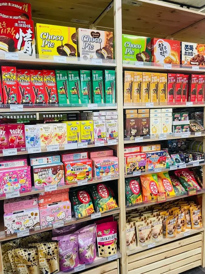 Pepero, Pocky, Hello Kitty cookies and matcha KitKat on shelves at OKASHI Group